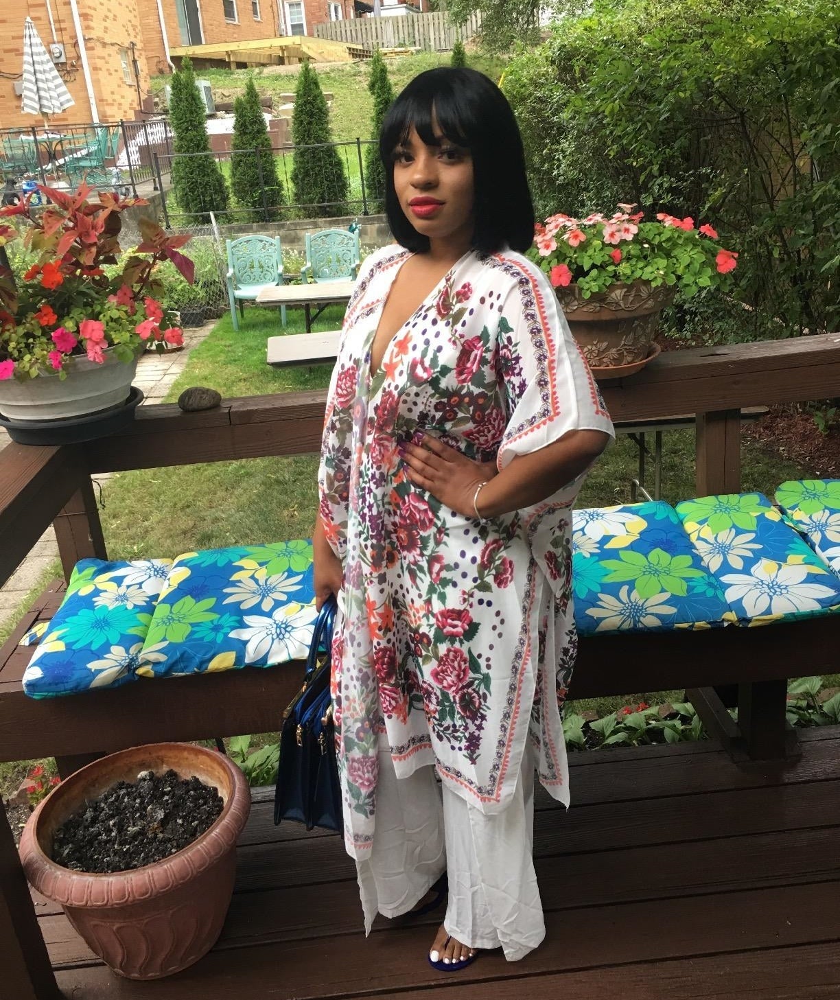 Reviewer wearing the open-front kimono in a white floral design