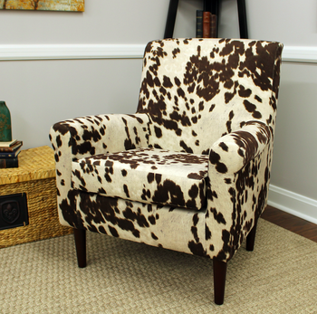 cow print chair in the corner of a room