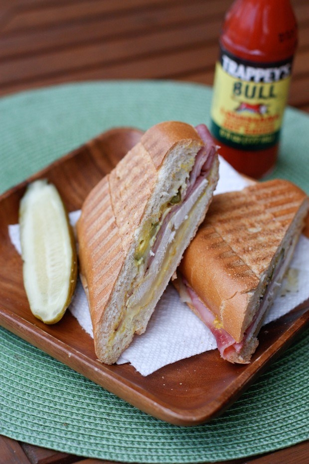 A Cuban sandwich on a cutting board