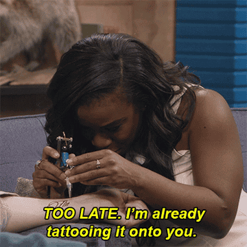 A woman tattooing someone and saying, &quot;Too late, I&#x27;m already tattooing it onto you&quot;