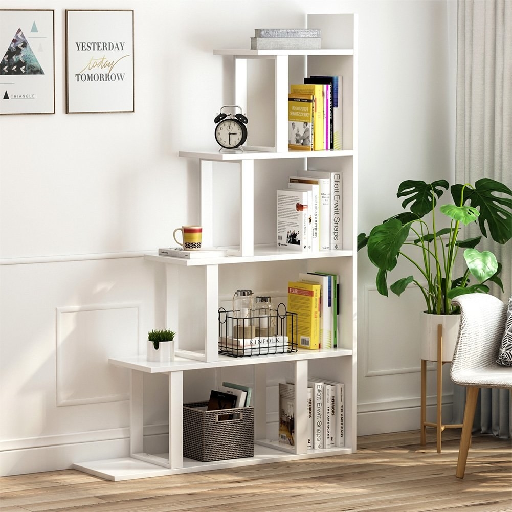 The white ladder bookcase with five shelves