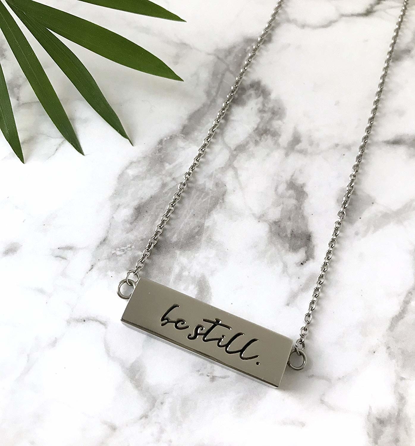 necklace that says &quot;be still&quot; and has a spot to stash a diffuser pad