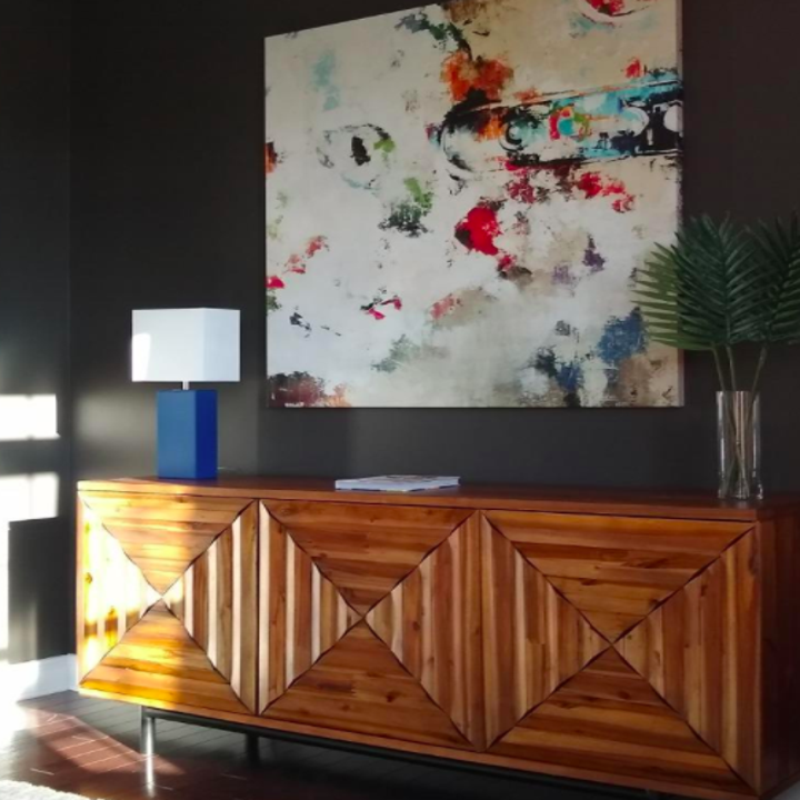 A customer review photo of the leather table lamp in blue on a side table