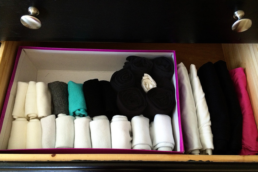folded socks in a shoe box, in a drawer