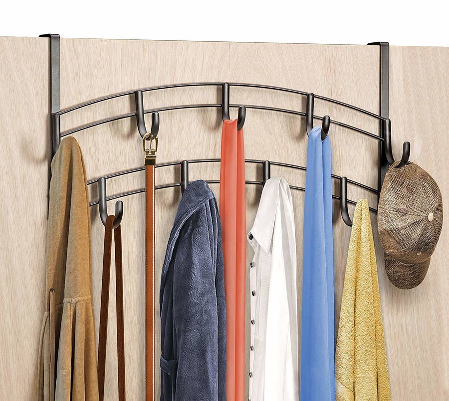 a lot of clothes hangers that are closely located next to each