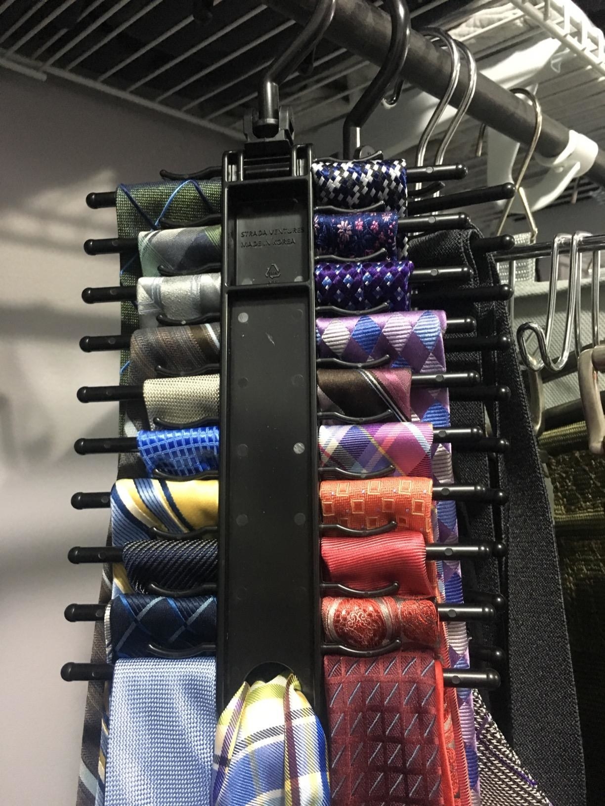 Reviewer photo of the tie rack with ties on each hook perfectly in place and organized
