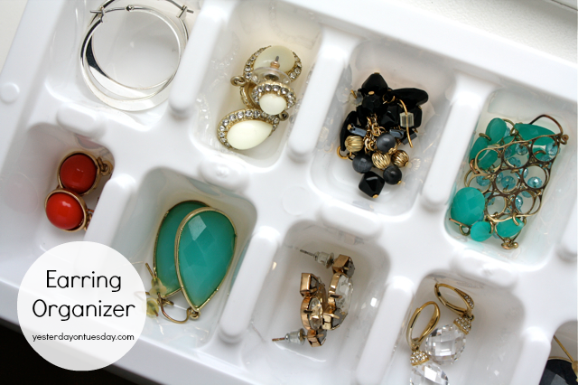 white ice cube tray being used to sort earrings