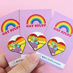 the rainbow heart pin with a queer couple in the middle