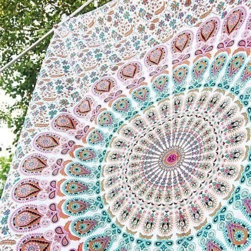 Promising review: "This is such a pretty tapestry. I used it all summer on the beach and it held up really well and looked really pretty. The colors are so soft and beautiful." —RJGet it from Amazon for $7.15.