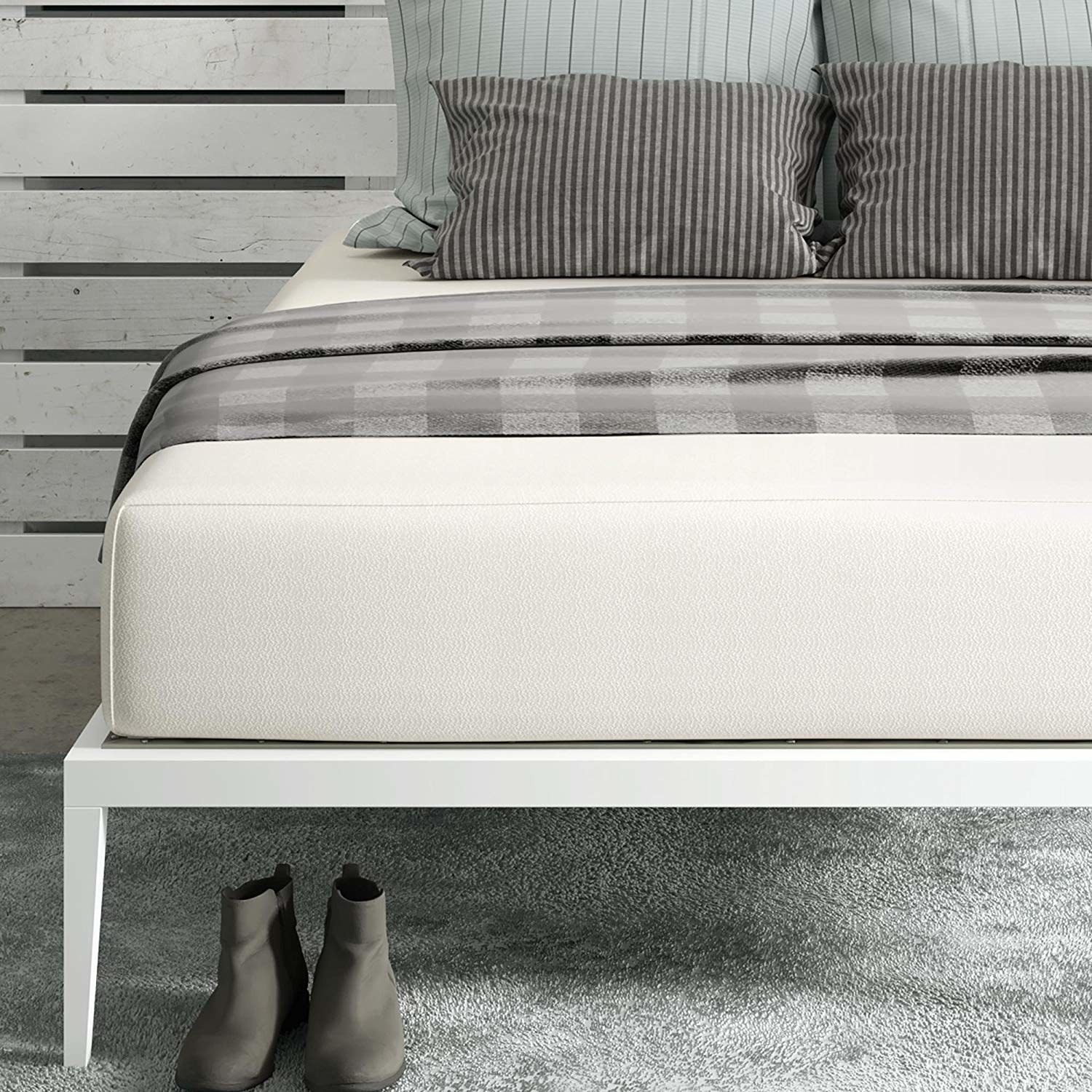 Large mattress on basic bed frame 