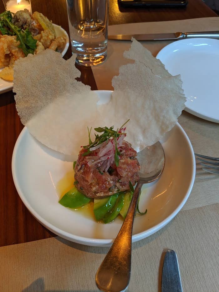 Served over a bed of sliced avocado, the spicy tuna tartare features sushi-grade tuna with julienne radish and micro-greens. Put a dollop of the tuna on the puffed rice cracker, and you got yourself an explosion of delicious firecrackers in your mouth.