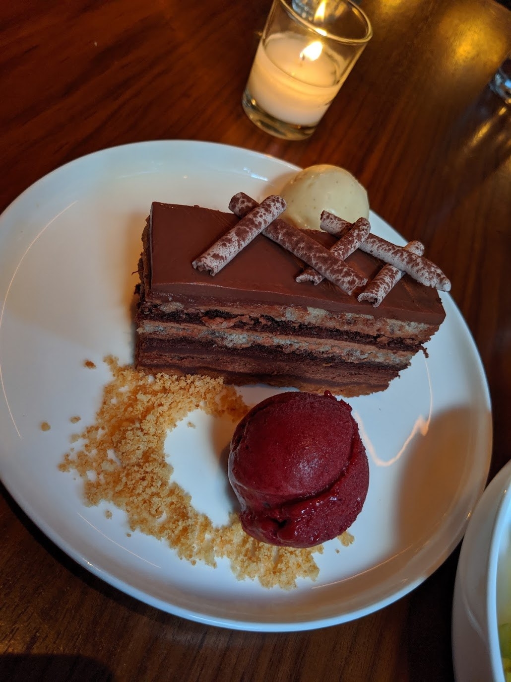 End the meal on a high note with this 14-layer rich, dark chocolate cake with peanut butter ice cream and passion fruit sorbet.