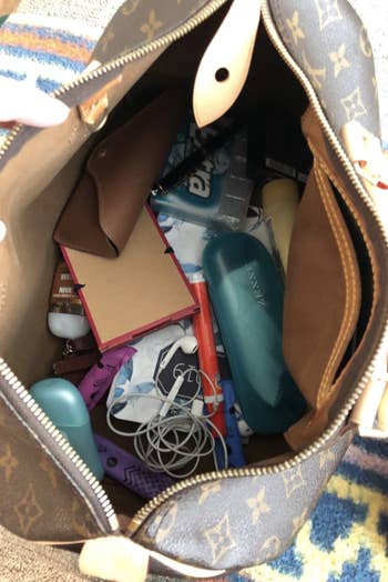 the inside of a cluttered purse