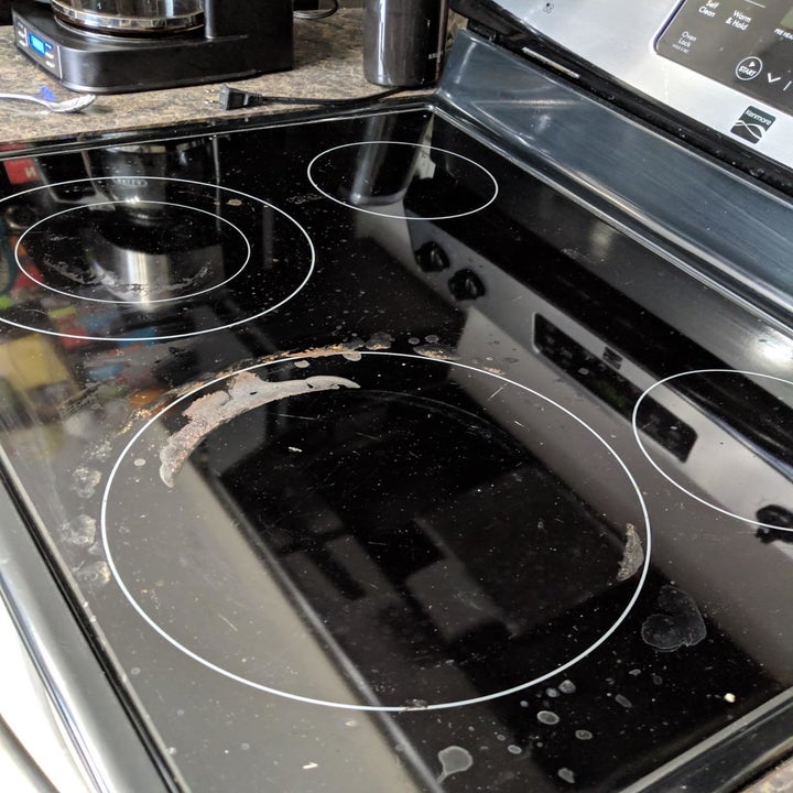 before: glass cooktop before, with cooked-on stains all over it