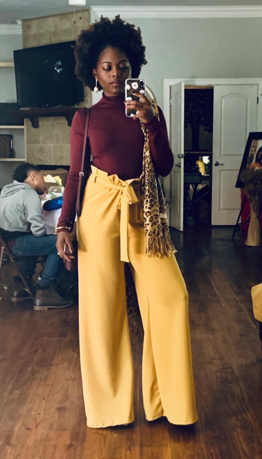 reviewer mirror selfie wearing the pants in yellow