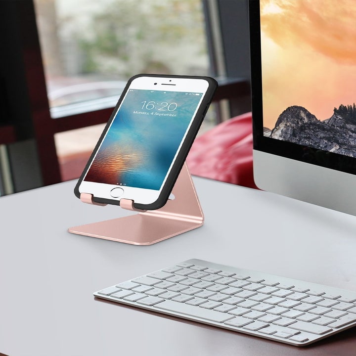 Phone stand placed on desk with iPhone sitting on top