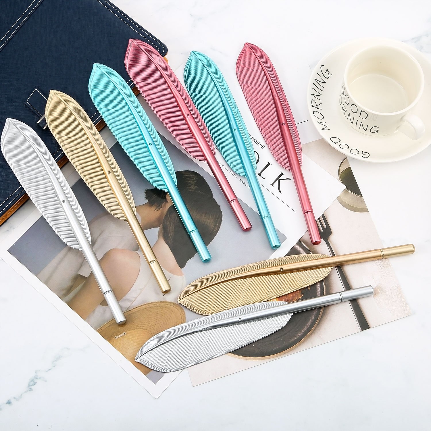 Six feather-shaped pens placed on desk