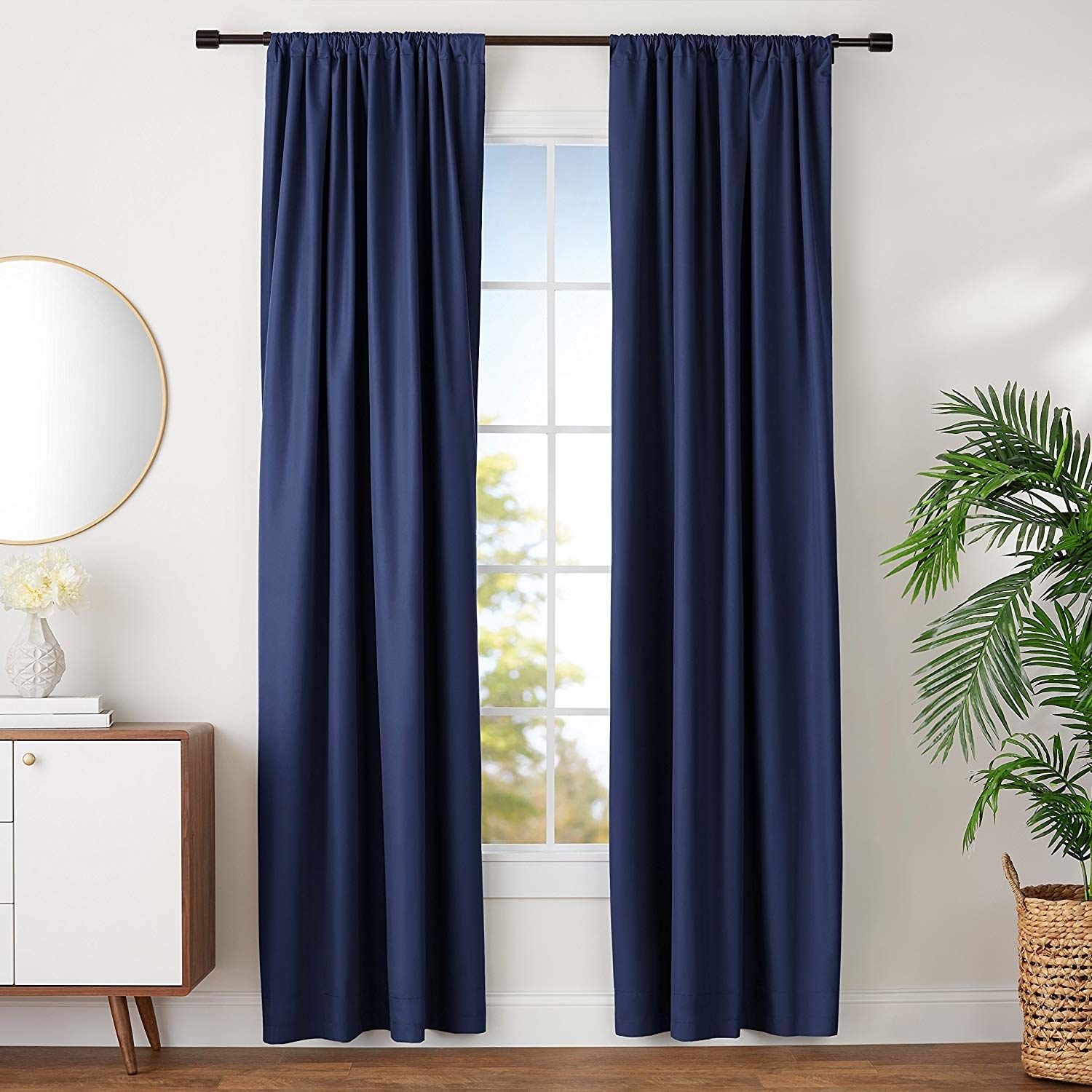 The panels in navy, reaching from above the window to one or two inches off the ground