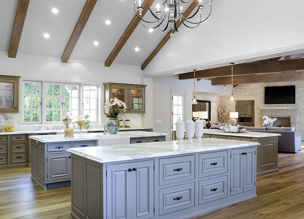 a well-lit kitchen with wooden beams