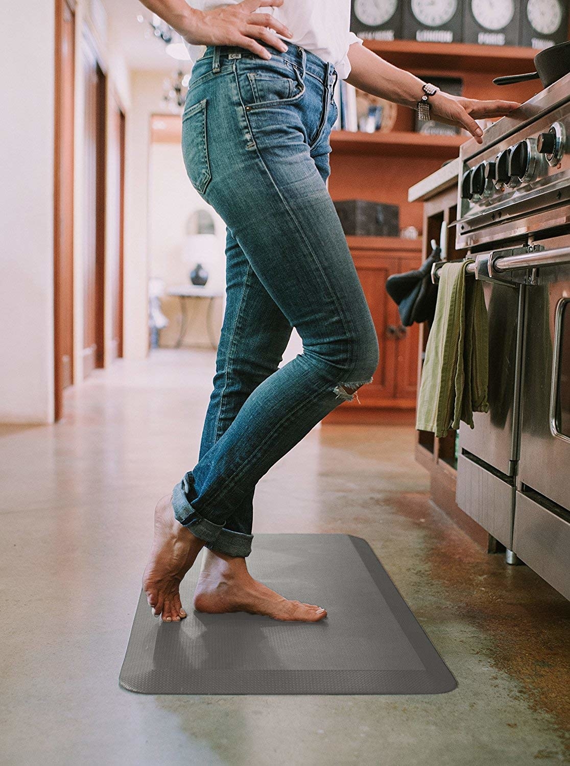 Model standing barefoot on the mat