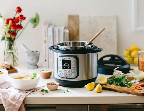 The silver appliance which has 14 buttons/settings and a digital screen