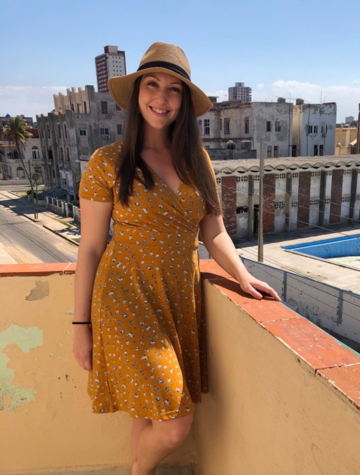 Reviewer wearing the dress in mustard print 