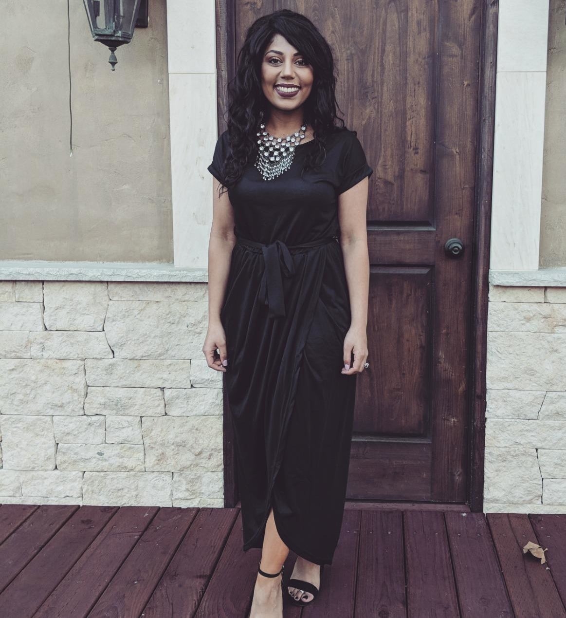 Reviewer wearing the dress in black