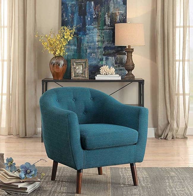 plush blue chair with wooden legs 