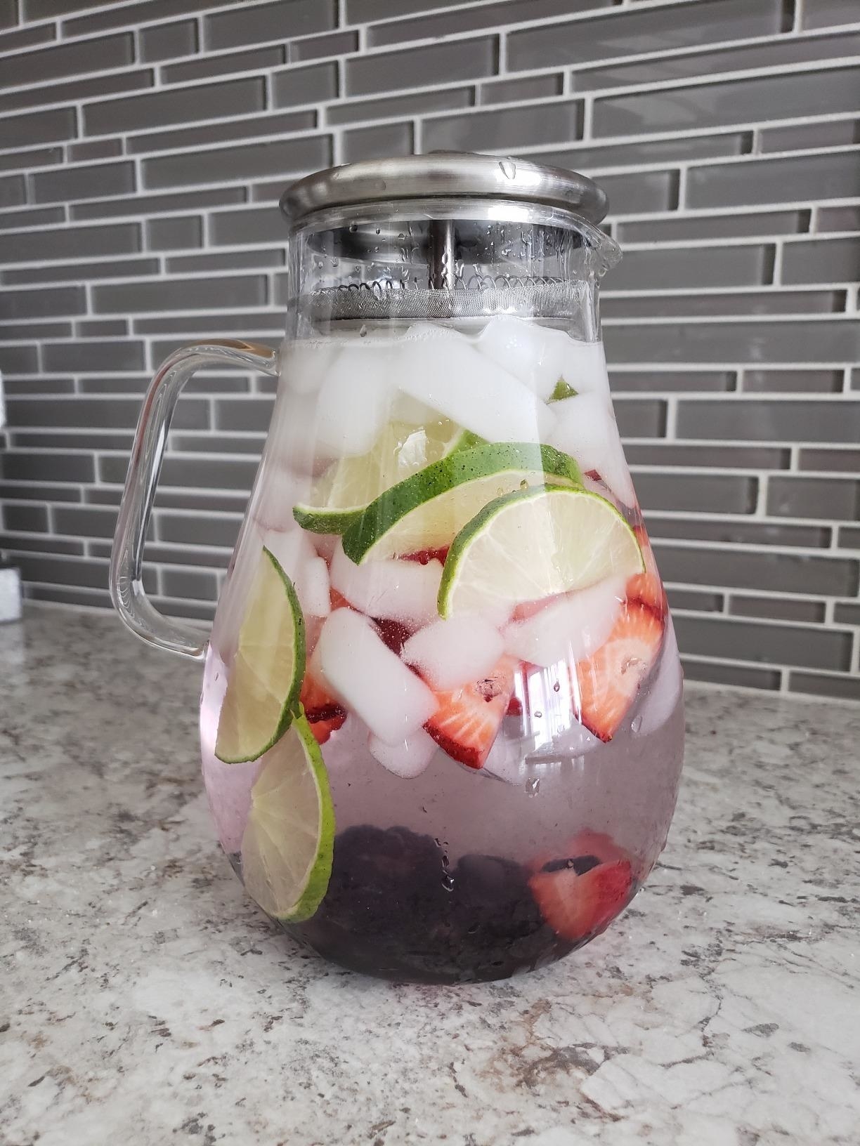 Reviewer photo of spa water with strawberries, lime, and blackberries in the pitcher