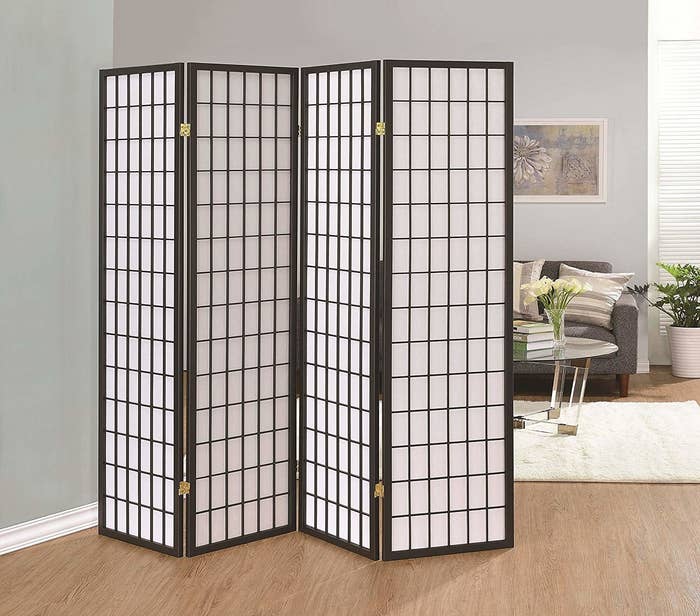 The screen with brown checkered design and white inside in a room