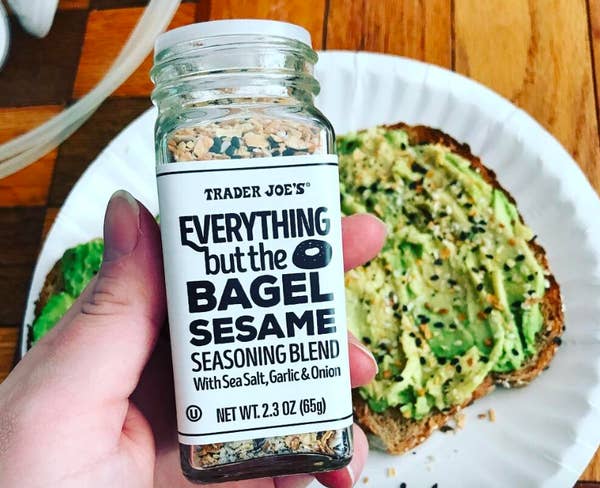 reviewer hand holding clear bottle labeled "Trader Joe's everything but the bagel" 