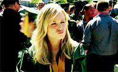 Gif of Kristen Bell in the TV show &quot;Veronica Mars&quot; nodding, winking, and making finger guns