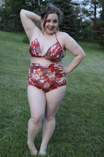 reviewer wearing bathing suit on grass