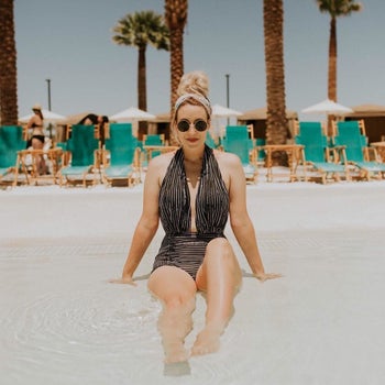 Reviewer is wearing the same suit but in a black and white thinner stripe design