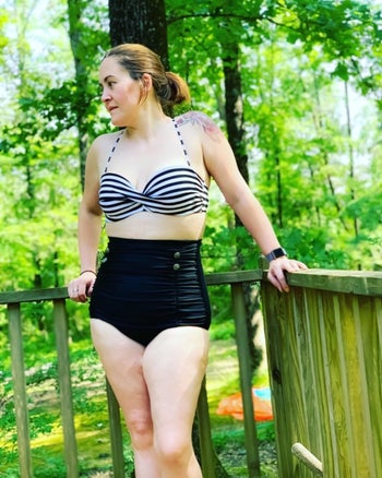 reviewer wearing bathing suit on a deck