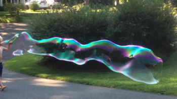 an extremely long, wavy bubble