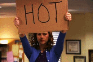 gif of Jenna Fischer in the TV show &quot;The Office&quot; holding a piece of cardboard that says &quot;Hot&quot;
