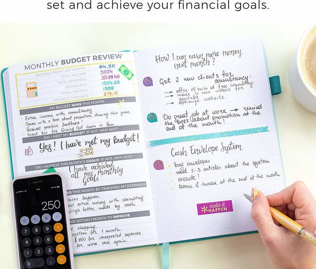 person writing in a monthly budget planner