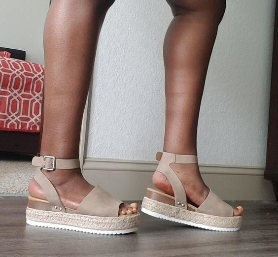 reviewer wearing sandals in taupe 