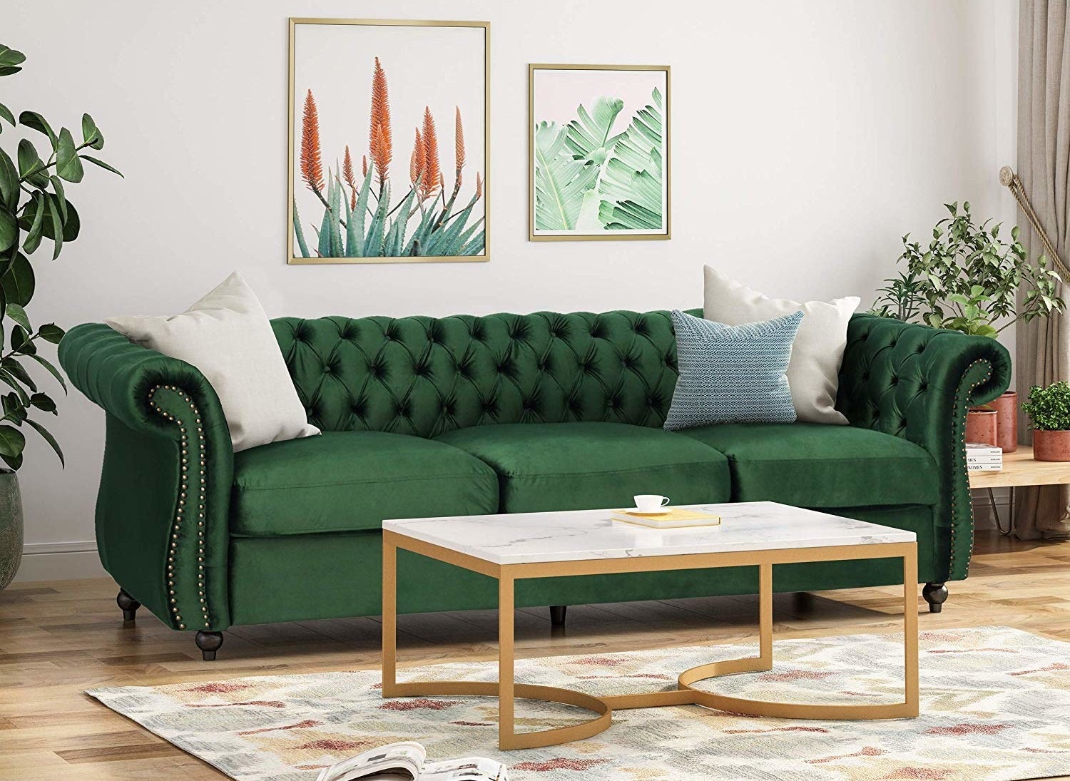 A lush green velvet chesterfield sofa.