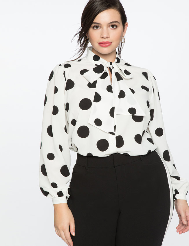 White and black polka dot blouse with a big bow tie