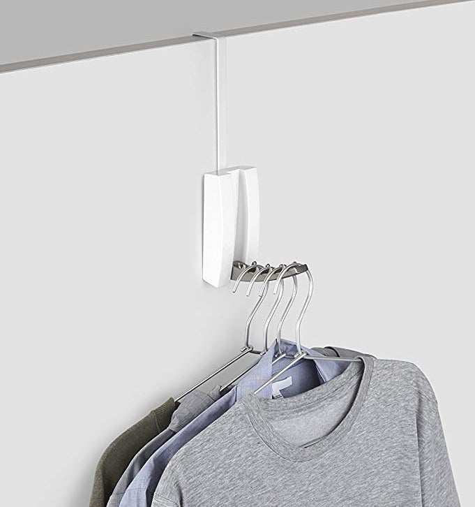 An over-door hook; it's sturdy enough to have the four hangers on its "tongue", which can flip up when not in use