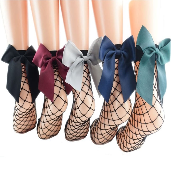 The black fishnet socks with black, burgundy, gray, blue, and green bows