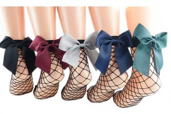 The black fishnet socks with black, burgundy, gray, blue, and green bows