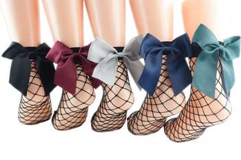 five pairs fishnet ankle socks with large bows in black, red, gray, blue, and green