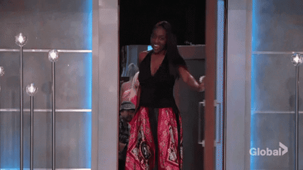 Gif of contestant from American&#x27;s Top Model opening door and looking excited 