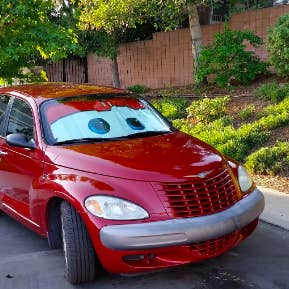Red car with matching eyeball sunshade 