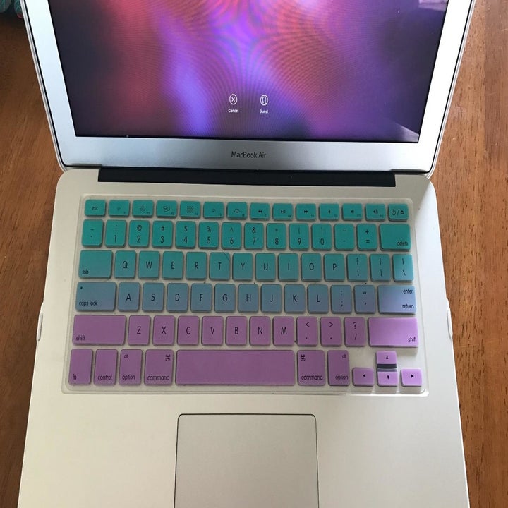 a blue, purple, and pink ombre cover on a laptop