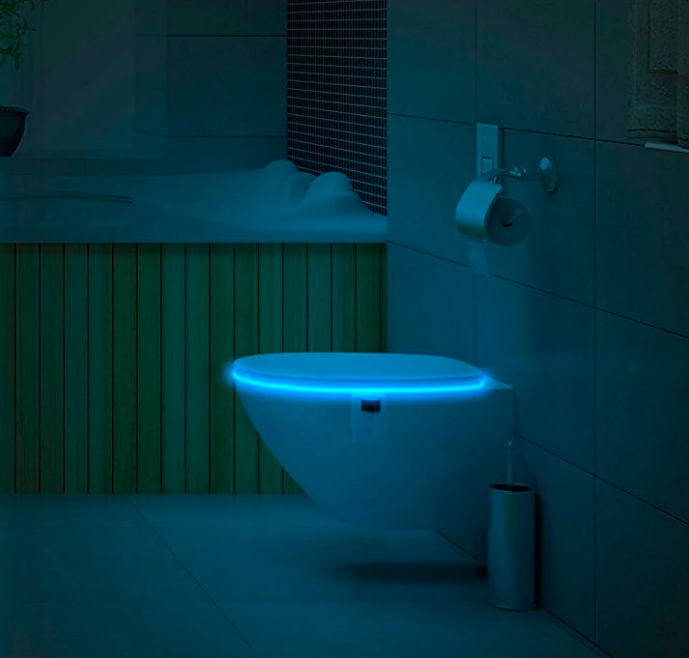 Toilet with light glowing inside bowl