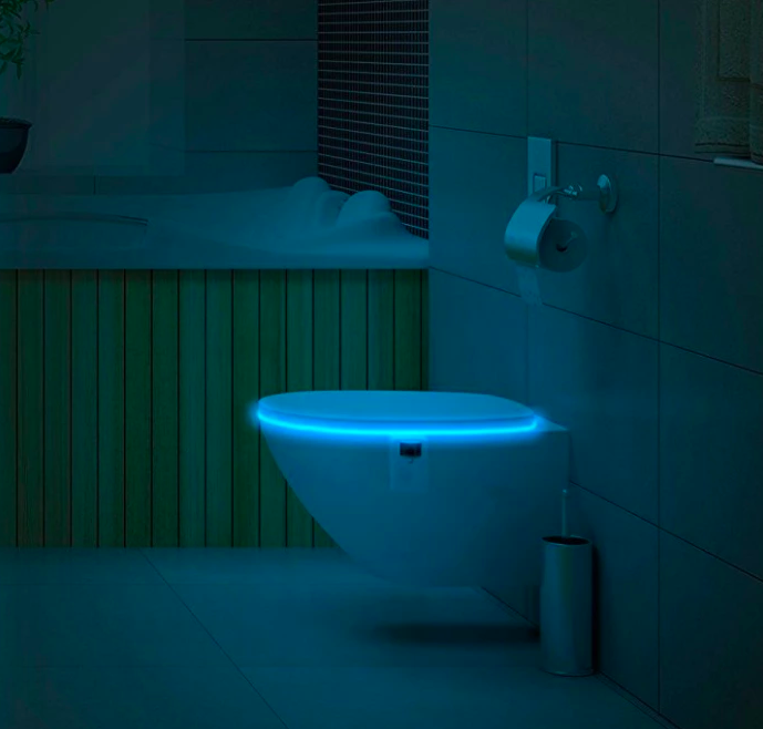 Toilet with light glowing inside bowl 